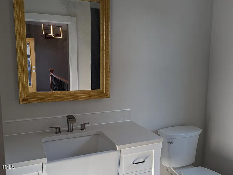 169 Prospect Avenue Raleigh, NC 27603 - Photo 18 of 23 a bathroom with a sink and a toilet
