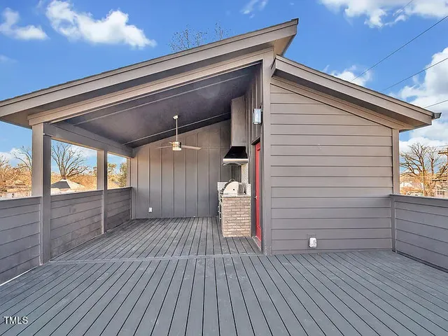 a view of a car park in front of house