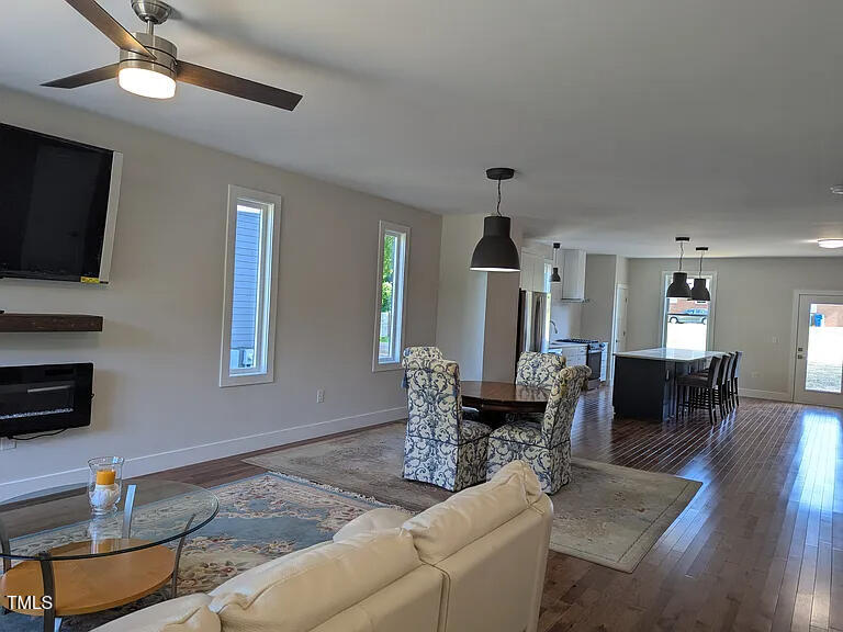 169 Prospect Avenue Raleigh, NC 27603 - Photo 3 of 23 a living room with furniture and a fireplace