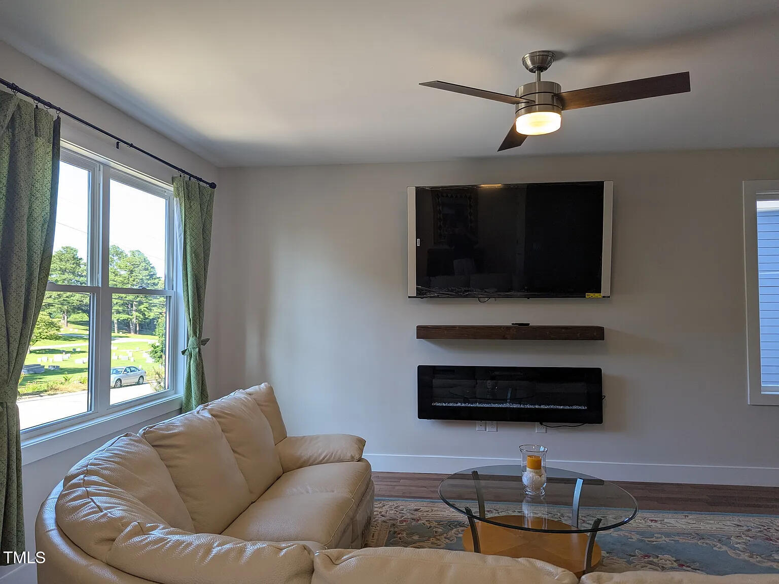 169 Prospect Avenue Raleigh, NC 27603 - Photo 6 of 23 a living room with furniture and a flat screen tv