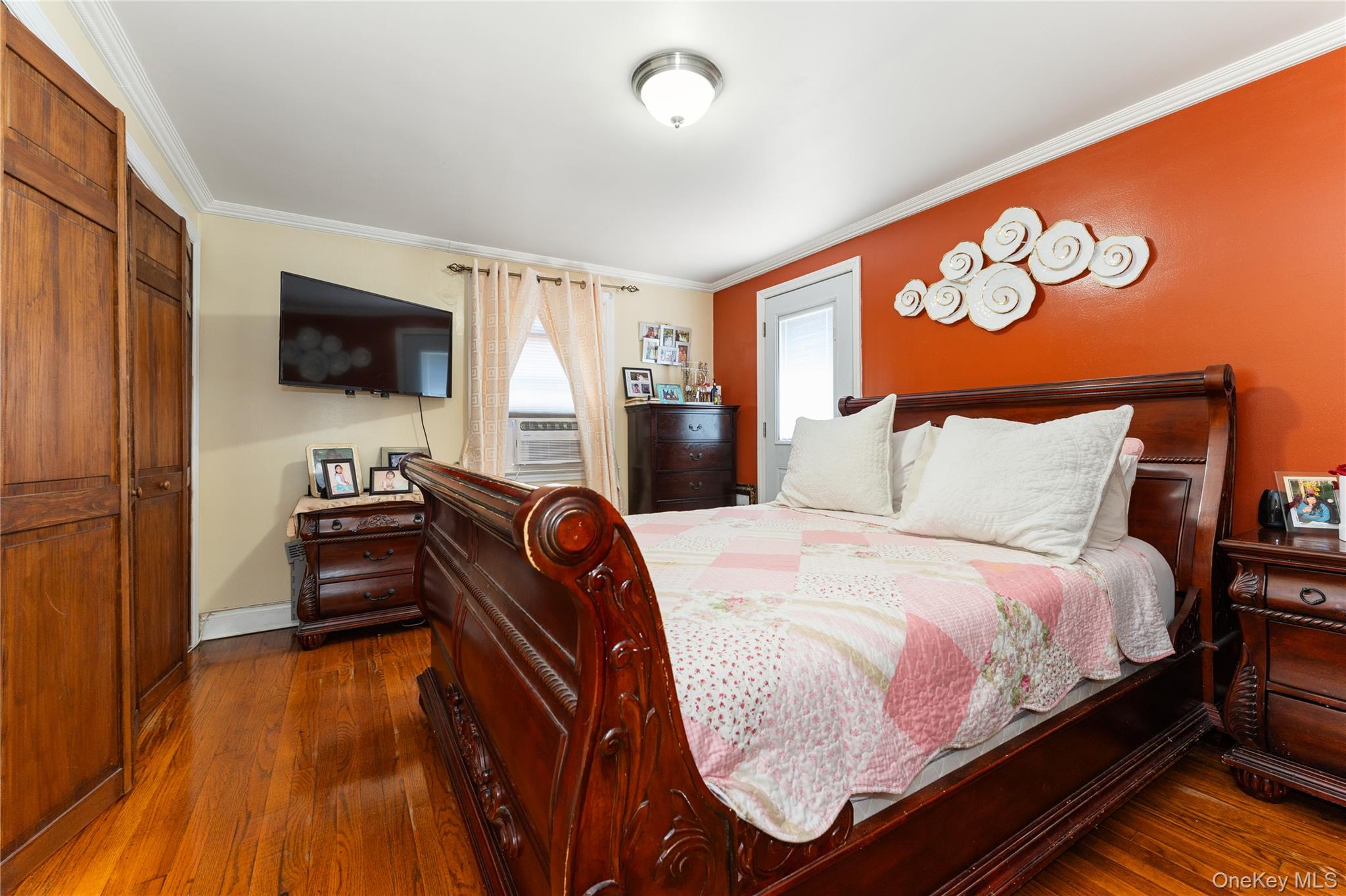 7 Mayfair Road Baldwin, NY 11510 - Photo 12 of 27 a bedroom with a bed and a flat screen tv