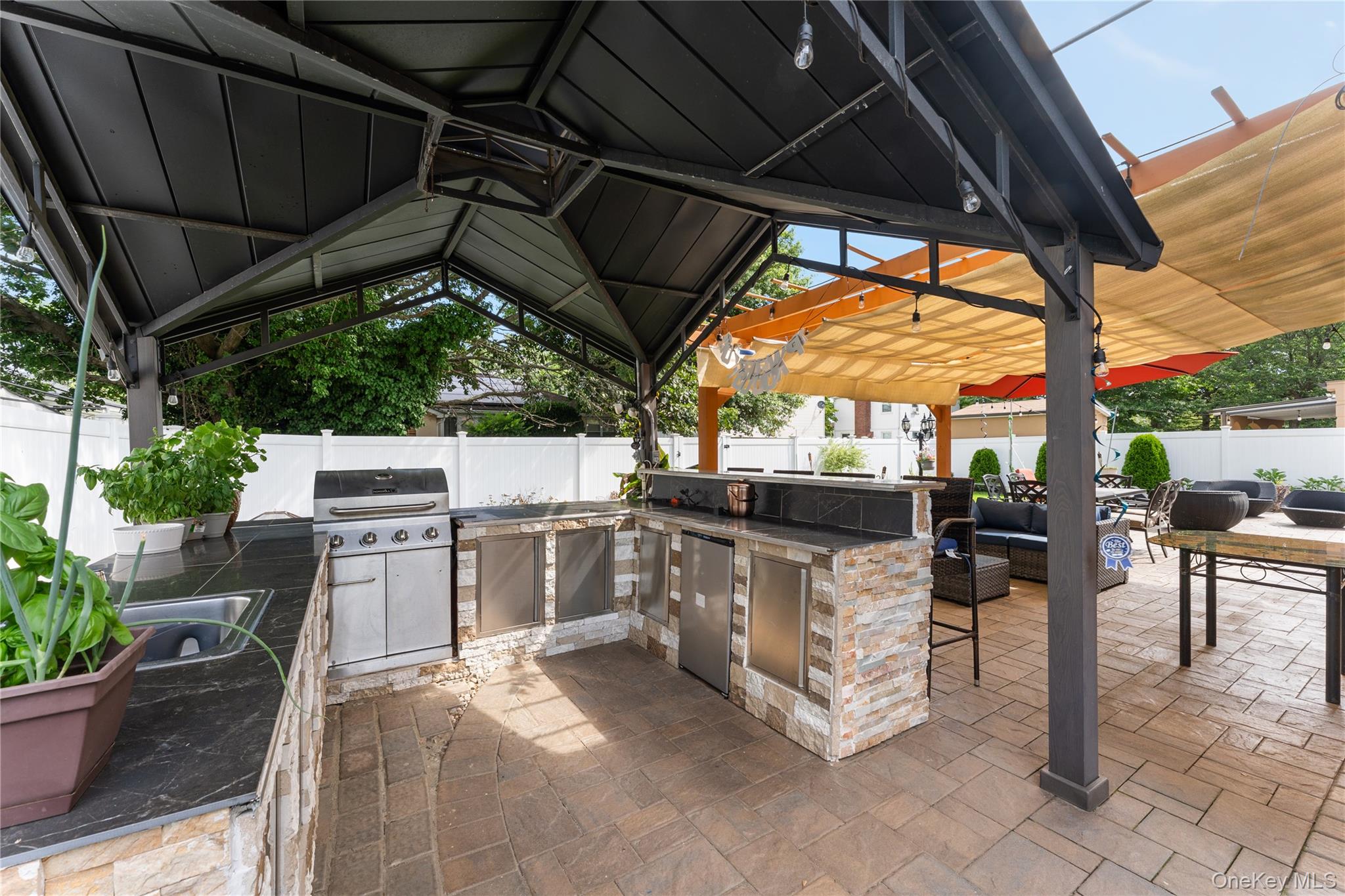 7 Mayfair Road Baldwin, NY 11510 - Photo 23 of 27 a view of a chairs and table in the patio