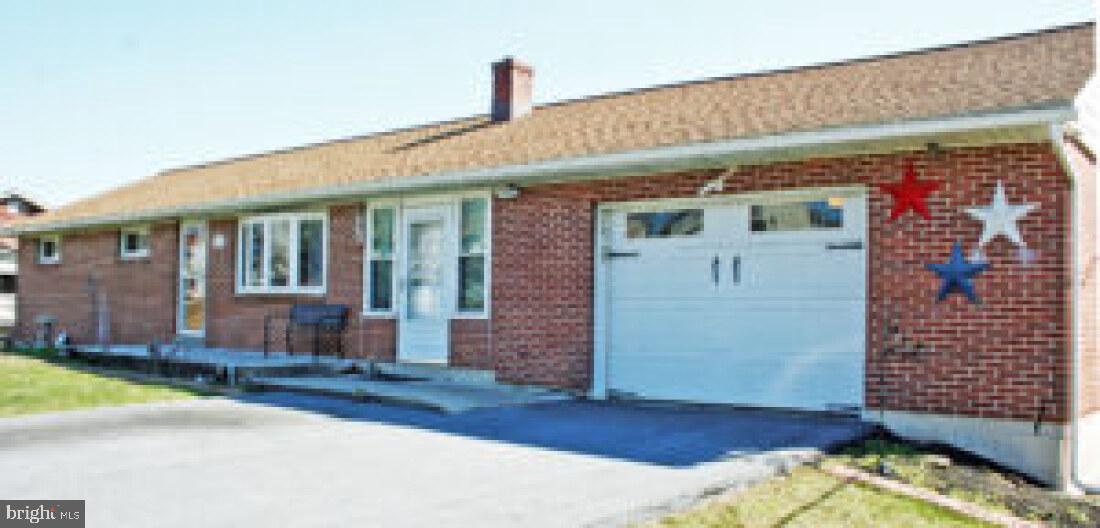 a front view of a house with a garage