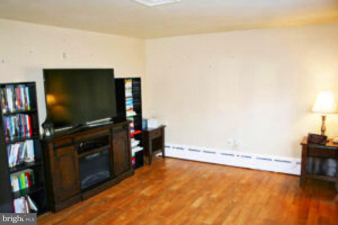828 Weavertown Road Lebanon, PA 17046 - Photo 14 of 38 a living room with furniture and a flat screen tv
