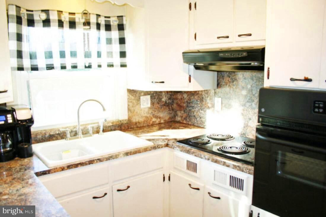 828 Weavertown Road Lebanon, PA 17046 - Photo 30 of 38 a kitchen with a stove and a sink