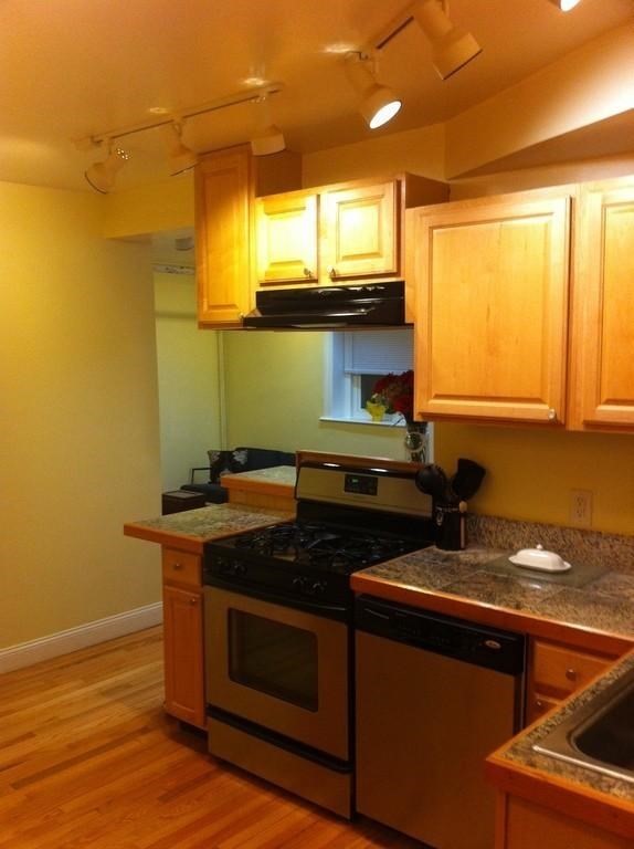 5 Colliston Road, Unit B Boston, MA 02135 - Photo 2 of 9 a kitchen with a stove and a sink