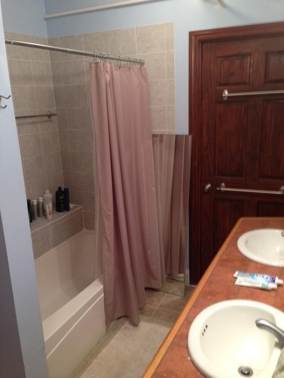 5 Colliston Road, Unit B Boston, MA 02135 - Photo 4 of 9 a bathroom with a sink and a mirror