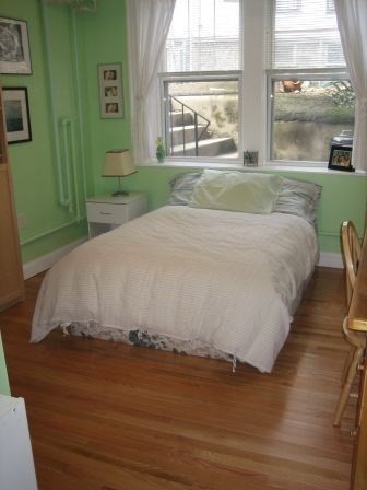 5 Colliston Road, Unit B Boston, MA 02135 - Photo 8 of 9 a bed sitting in a bedroom next to a window