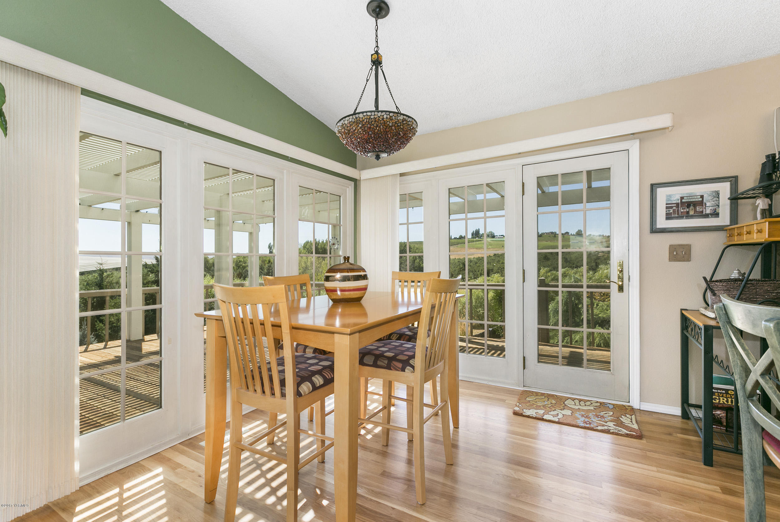 13621 Summitview Ext Road Yakima, WA 98908 - Photo 21 of 35 a view of a dining room with furniture window and wooden floor