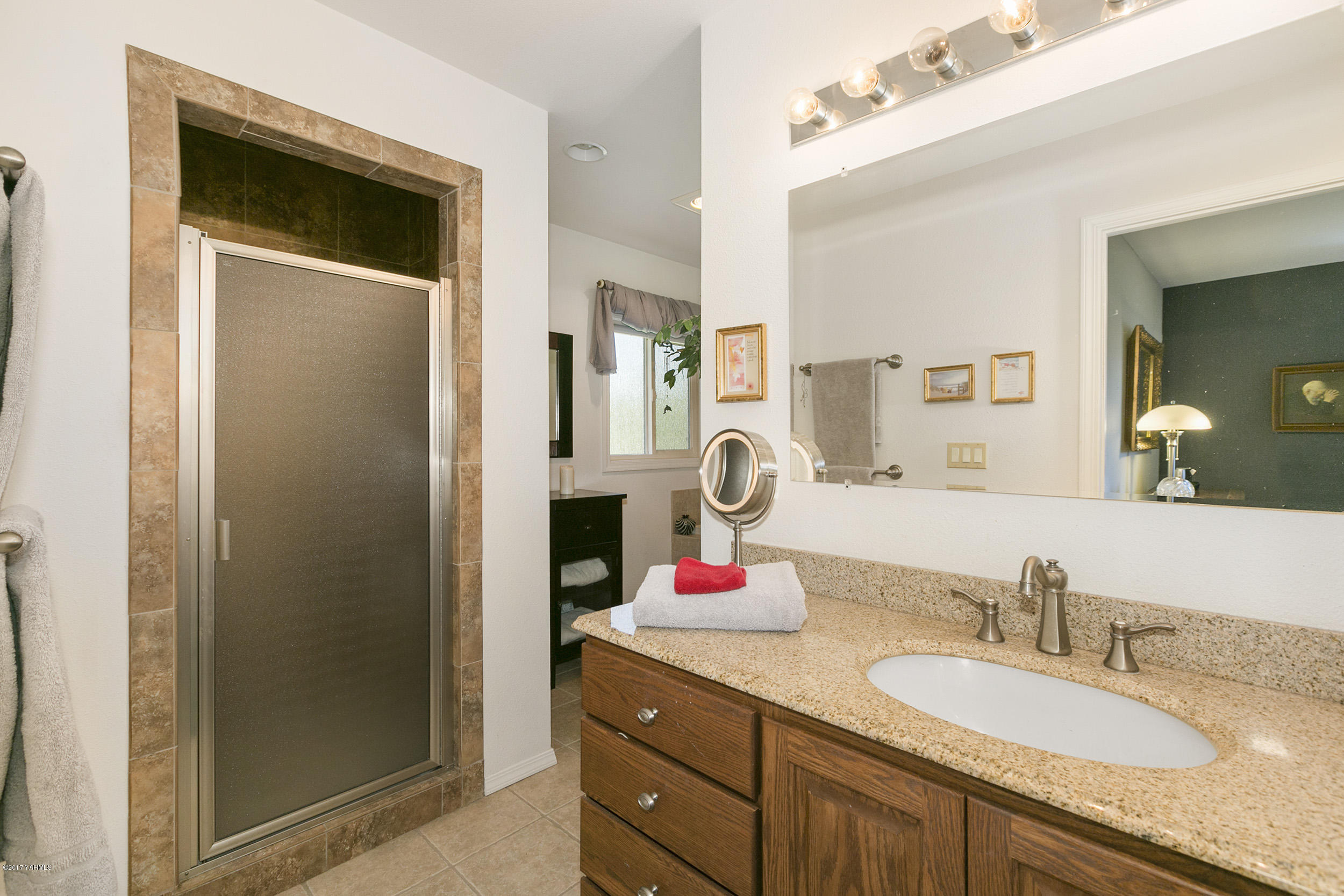 13621 Summitview Ext Road Yakima, WA 98908 - Photo 26 of 35 a bathroom with a granite countertop double vanity sink and a mirror