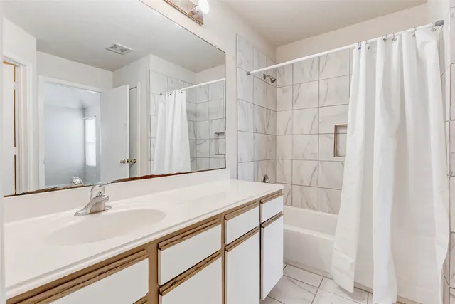 a bathroom with a sink and a bathtub