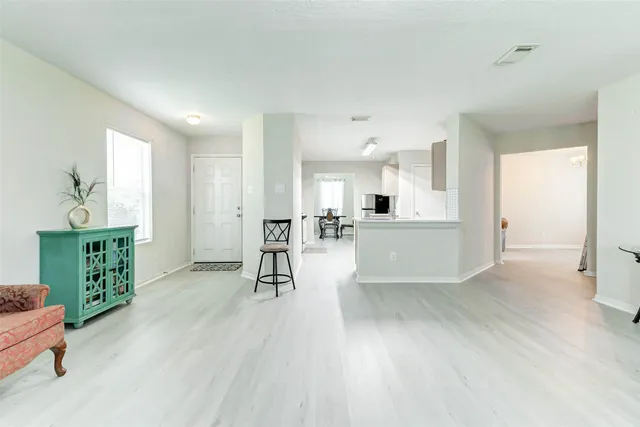 a view of a kitchen and dining room