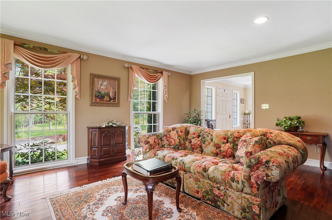 4432 Ira Road Akron, OH 44333 - Photo 6 of 50 Living room featuring hardwood / wood-style flooring, ornamental molding, and baseboards