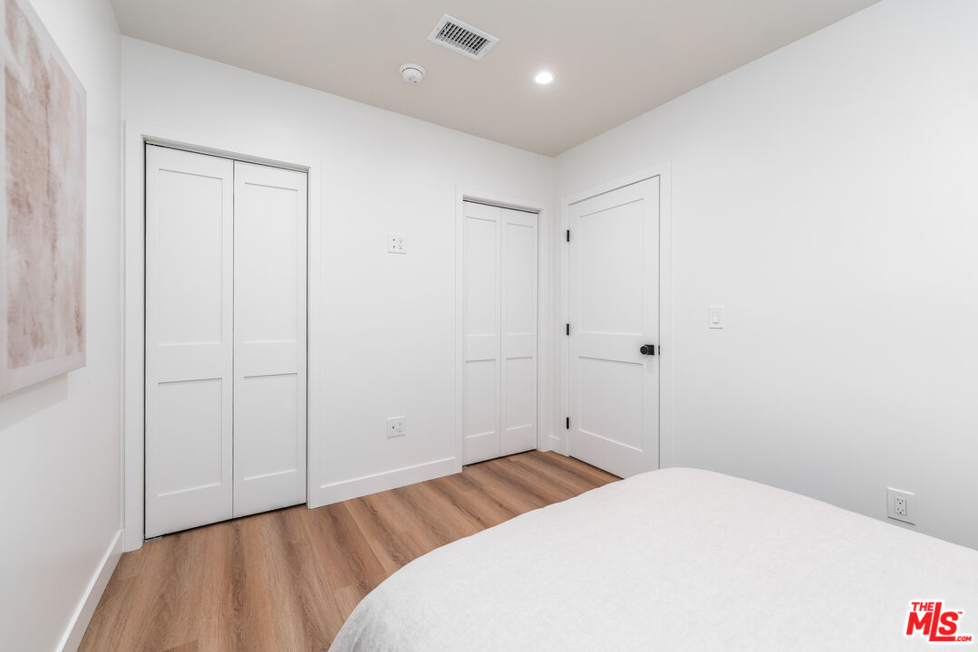 Undisclosed Address Los Angeles, CA 90008 - Photo 11 of 28 a bedroom with a bed and a window