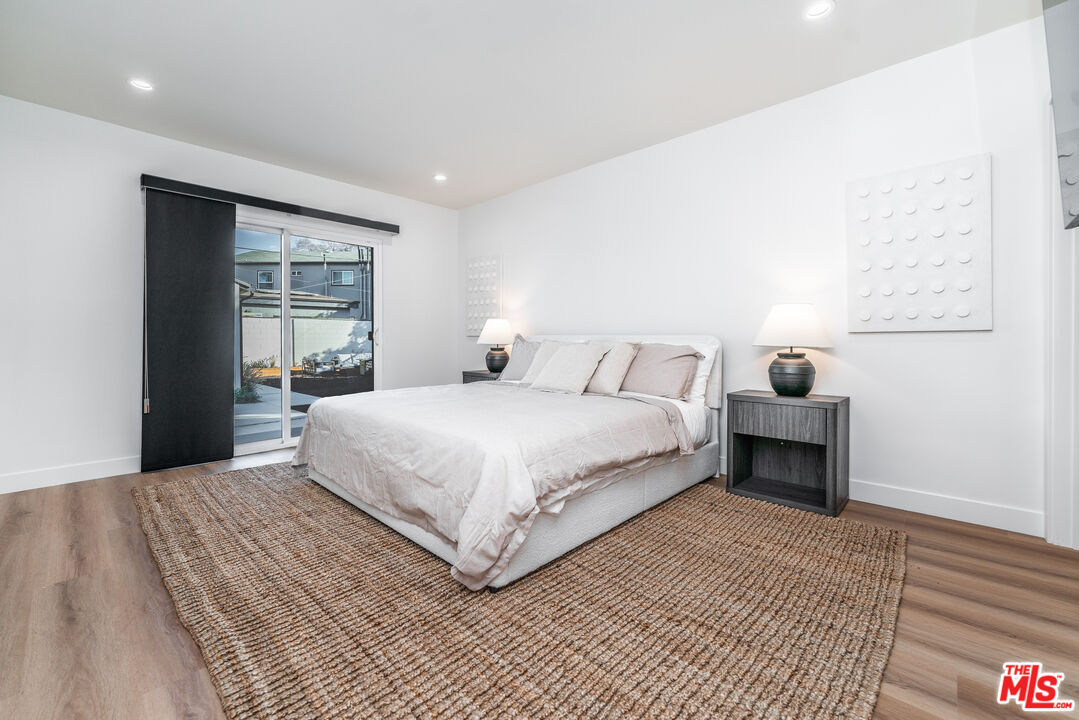 Undisclosed Address Los Angeles, CA 90008 - Photo 13 of 28 a bedroom with a bed and a window