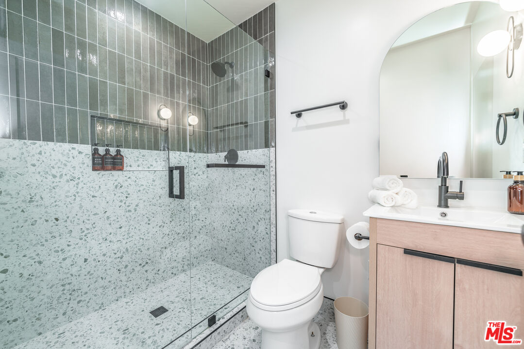 Undisclosed Address Los Angeles, CA 90008 - Photo 22 of 28 a bathroom with a sink a toilet and shower