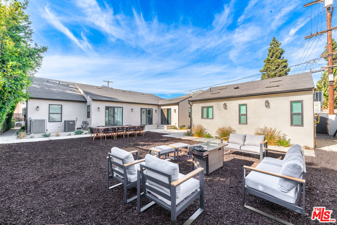 Undisclosed Address Los Angeles, CA 90008 - Photo 23 of 28 a view of a patio with couches table and chairs and potted plants