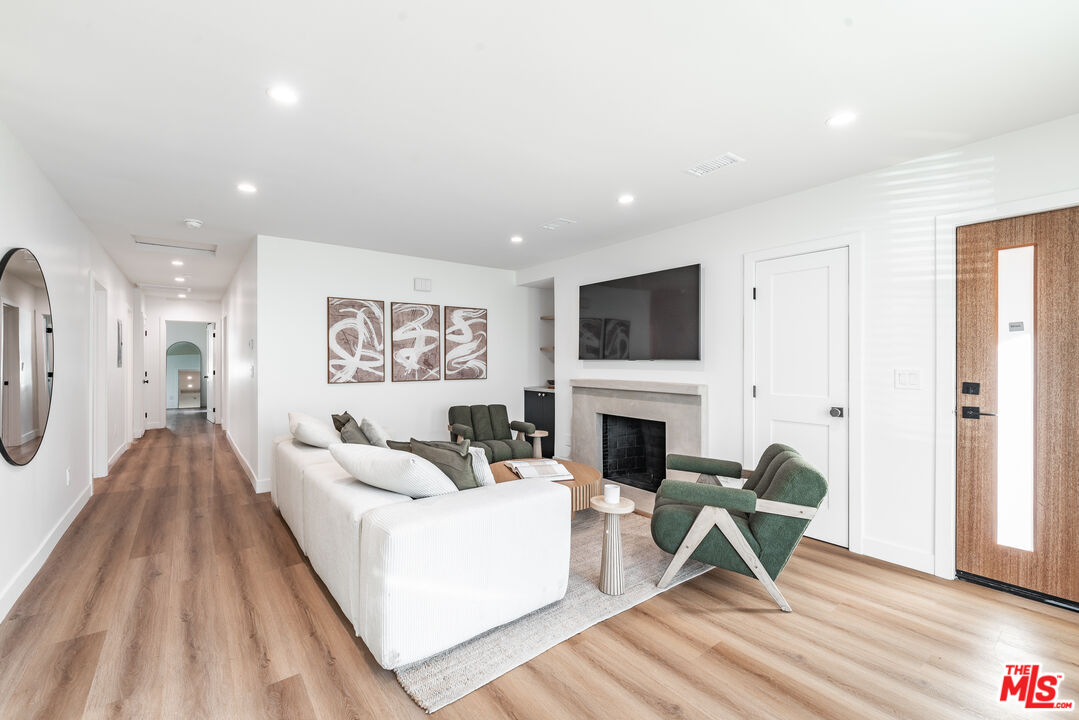 Undisclosed Address Los Angeles, CA 90008 - Photo 3 of 28 a living room with furniture and a fireplace