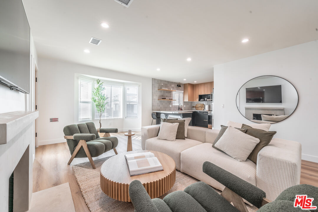 Undisclosed Address Los Angeles, CA 90008 - Photo 6 of 28 a living room with furniture and a large window
