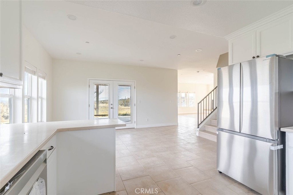 2575 Rale Drive Palmdale, CA 93550 - Photo 11 of 41 a view of a kitchen with a refrigerator cabinets and a window