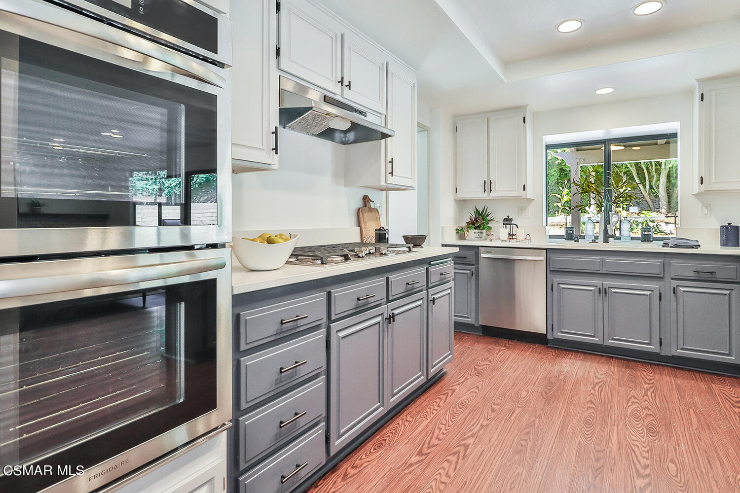 3091 Omega Avenue Simi Valley, CA 93063 - Photo 30 of 66 a kitchen with a sink stove and cabinets