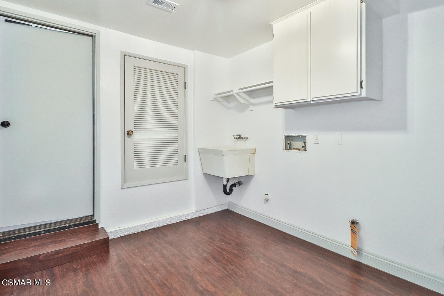 3091 Omega Avenue Simi Valley, CA 93063 - Photo 35 of 66 a view of an empty room with wooden floor and a window