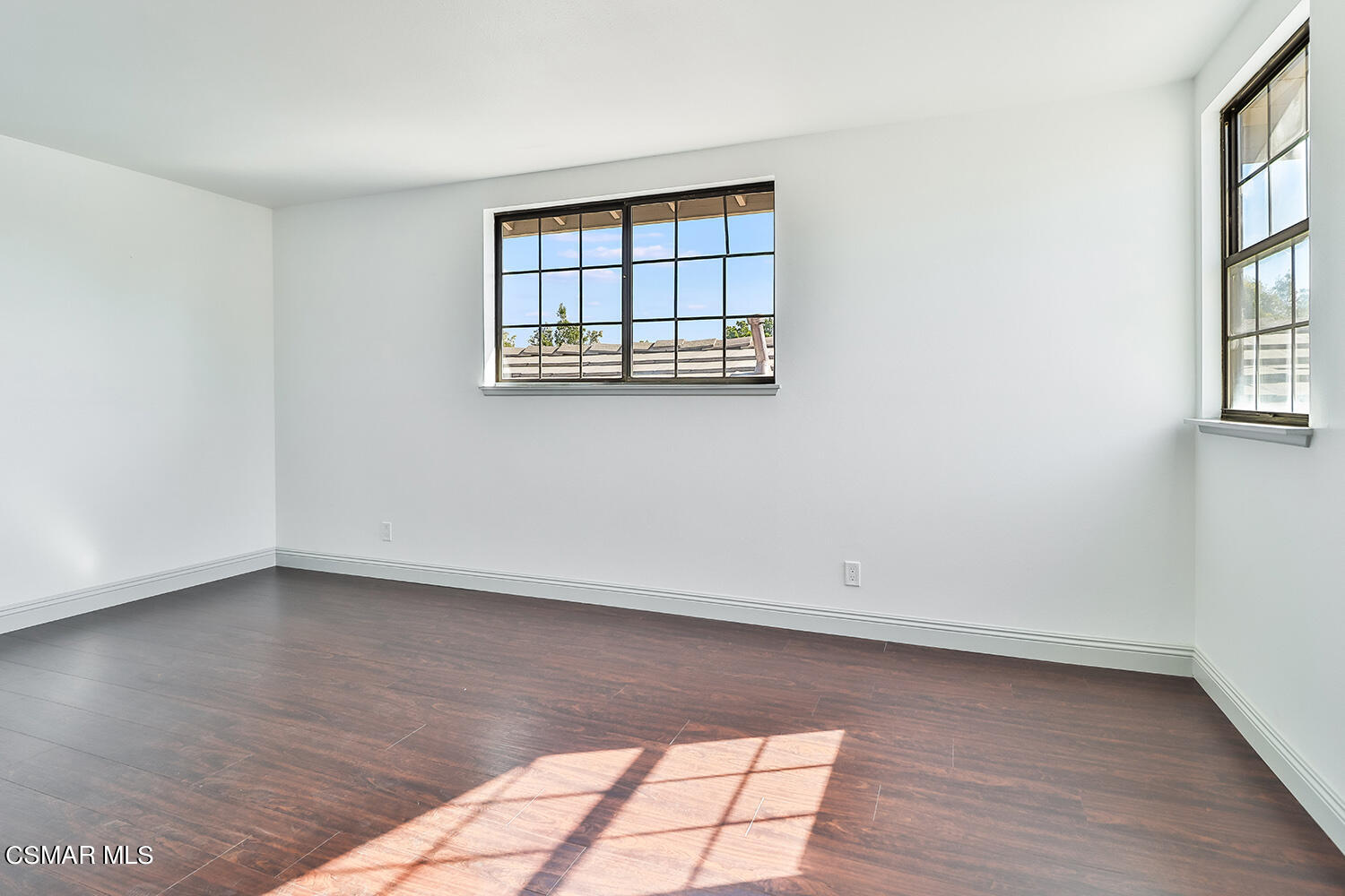 3091 Omega Avenue Simi Valley, CA 93063 - Photo 39 of 66 an empty room with wooden floor and windows