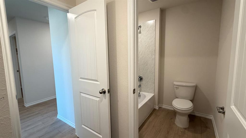 2007 Reveille Way Terrell, TX 75160 - Photo 4 of 31 a bathroom with a toilet and a shower
