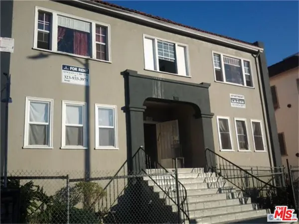 a front view of a house with a glass door