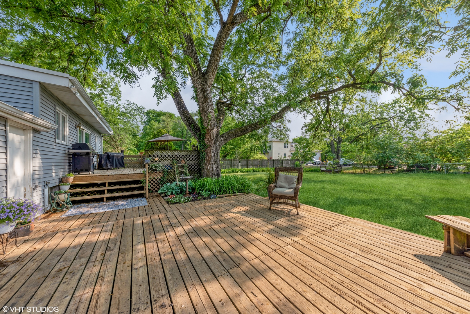18326 Riegel Road Homewood, IL 60430 - Photo 17 of 17 a view of a patio with a table and chairs with wooden floor and fence