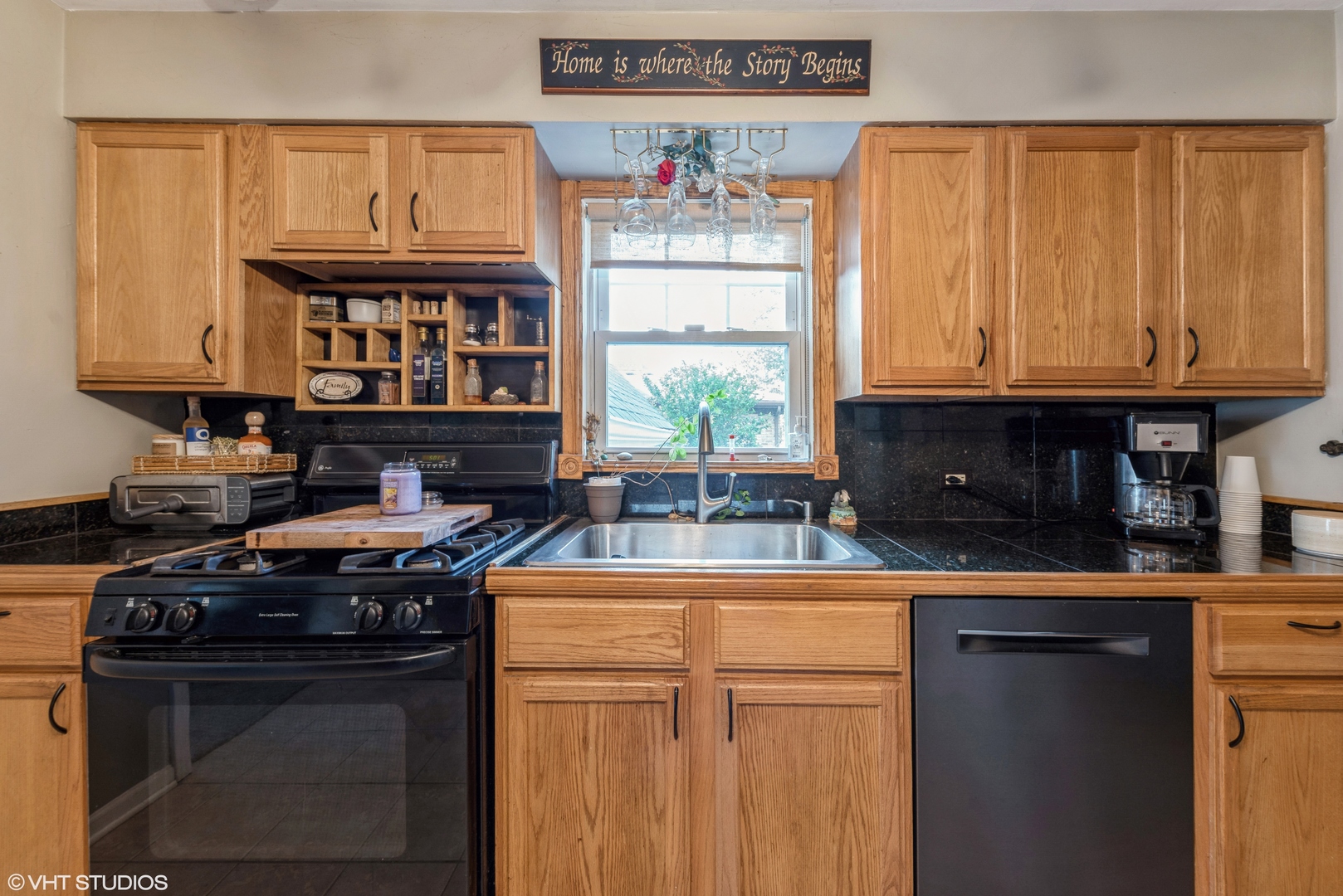 18326 Riegel Road Homewood, IL 60430 - Photo 5 of 17 a kitchen with stainless steel appliances granite countertop a stove a sink and a microwave