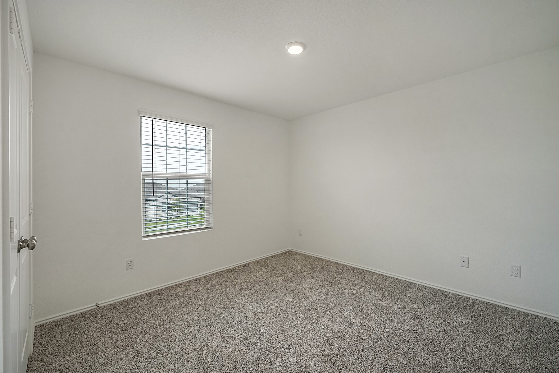 932 Mallow Road Leander, TX 78641 - Photo 26 of 34 A well-lit bedroom featuring soft carpet flooring and a window with natural light.