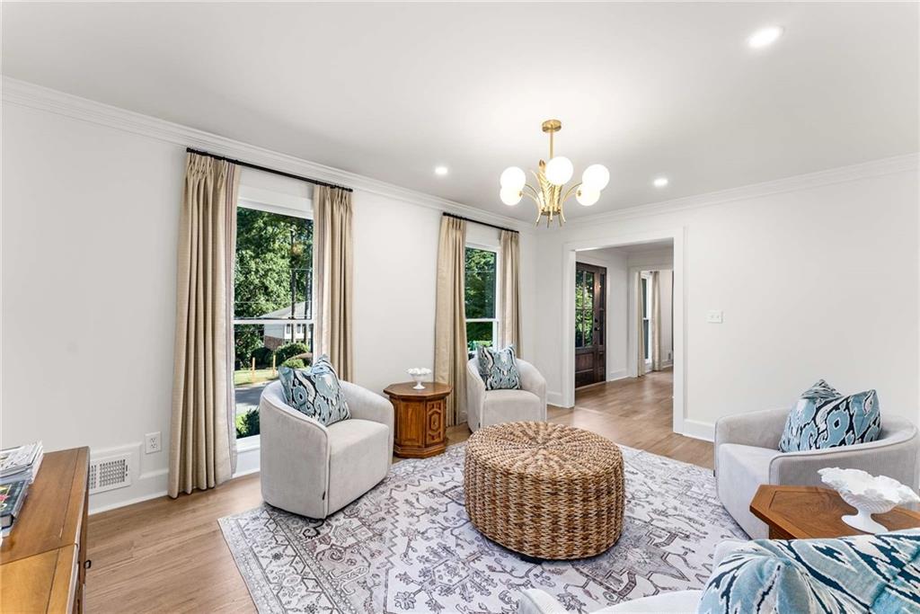 3549 Castlehill Court Tucker, GA 30084 - Photo 16 of 41 a living room with furniture and a chandelier