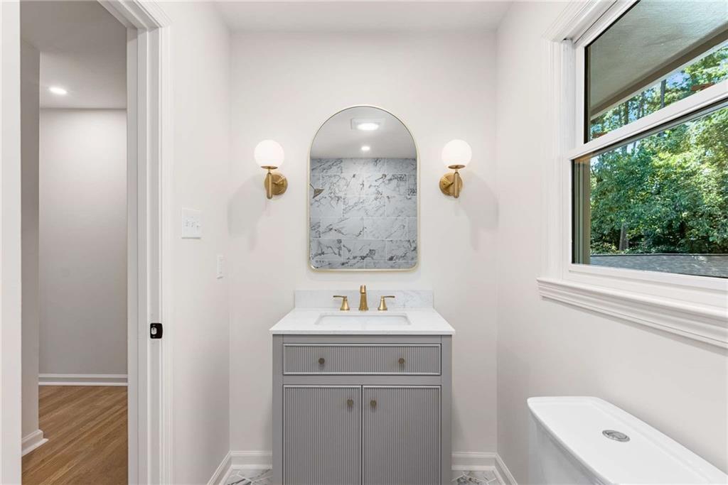 3549 Castlehill Court Tucker, GA 30084 - Photo 28 of 41 a bathroom with a sink and a mirror