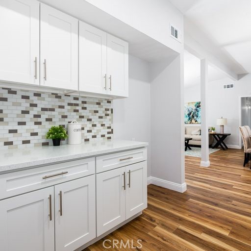 3254 Laurel Drive Riverside, CA 92509 - Photo 11 of 26 a kitchen with granite countertop white cabinets and white appliances