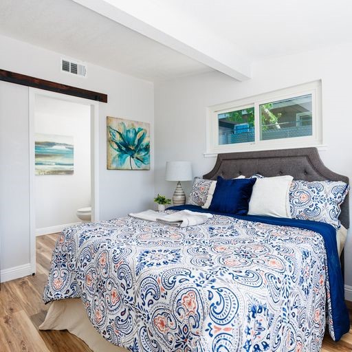 3254 Laurel Drive Riverside, CA 92509 - Photo 17 of 26 a bedroom with a large bed and a window