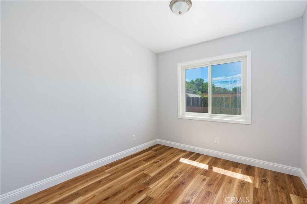 3254 Laurel Drive Riverside, CA 92509 - Photo 23 of 26 a view of a room with wooden floor and windows