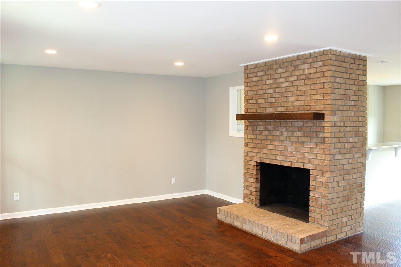 Awesome, open Family Room complete with gorgeous hardwoods, recessed lighting and wood burning FP!