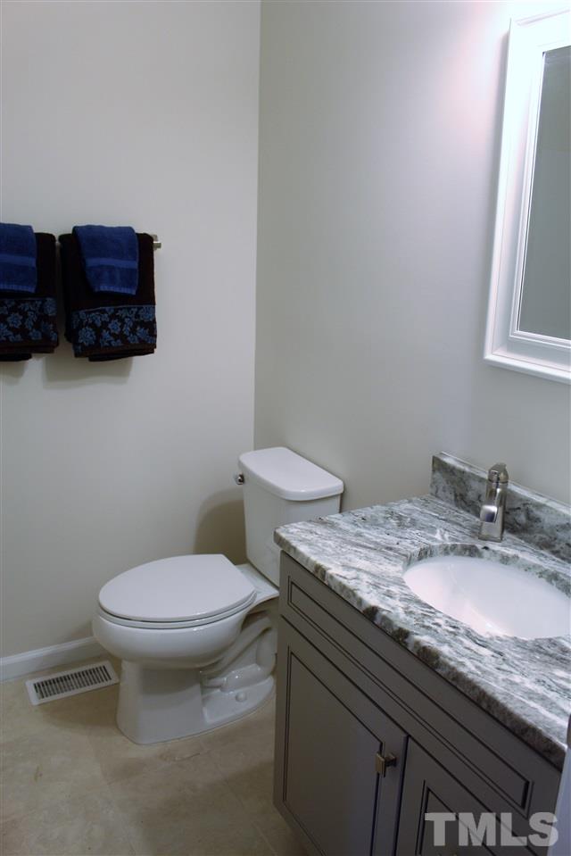 6100 Donnybrook Road Raleigh, NC 27606 - Photo 13 of 16 Totally Renovated Bathroom... Custom Cabinets, granite, Tile Floor~