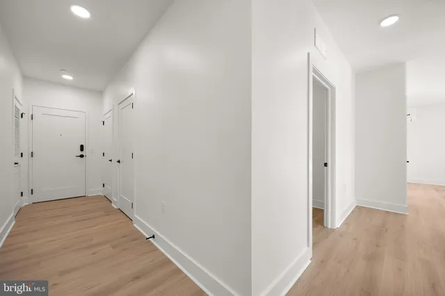 a view of a room with wooden floor