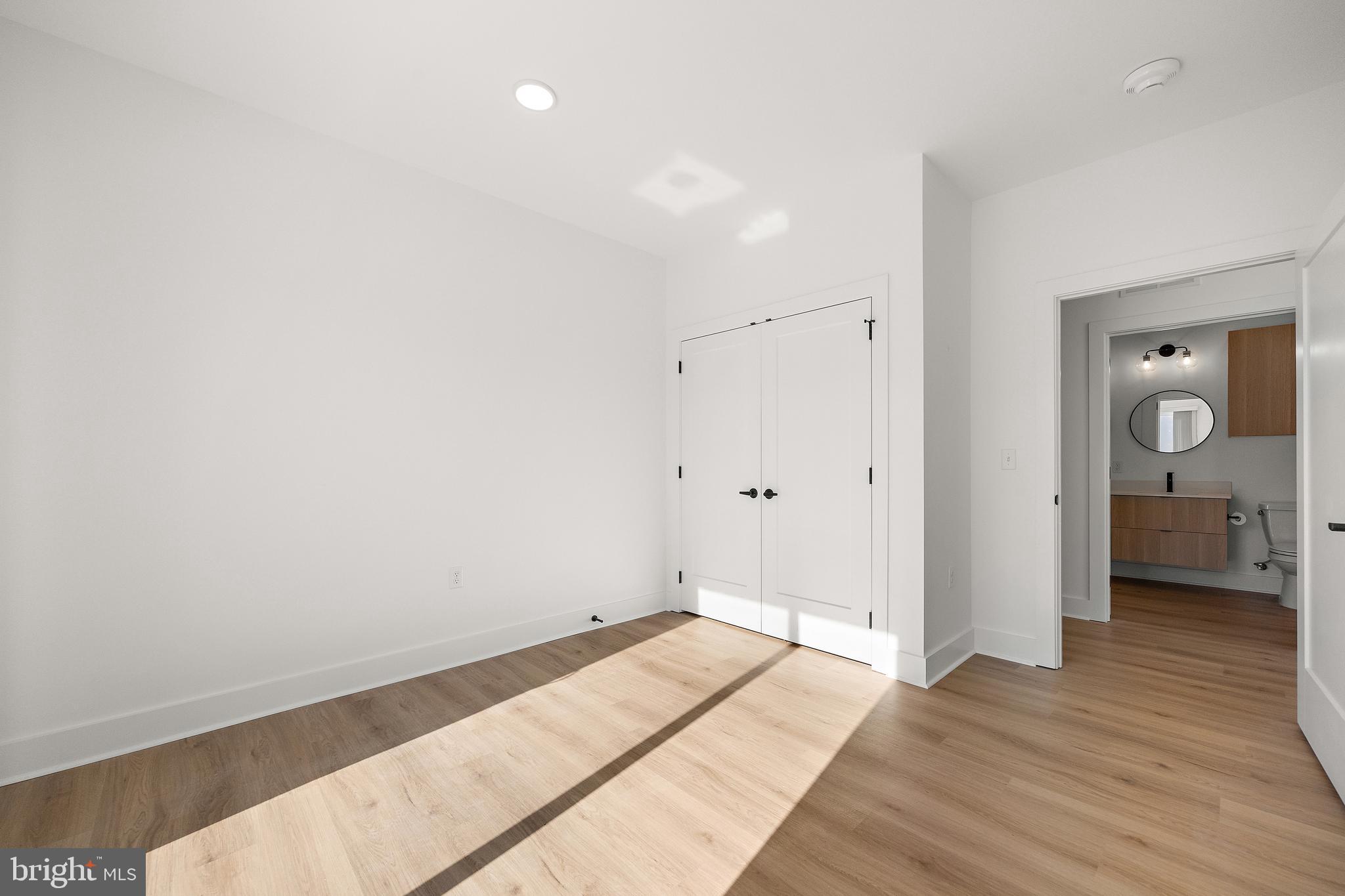 801 North Market Street, Unit 305 Wilmington, DE 19801 - Photo 6 of 11 a view of a room with wooden floor and bathroom