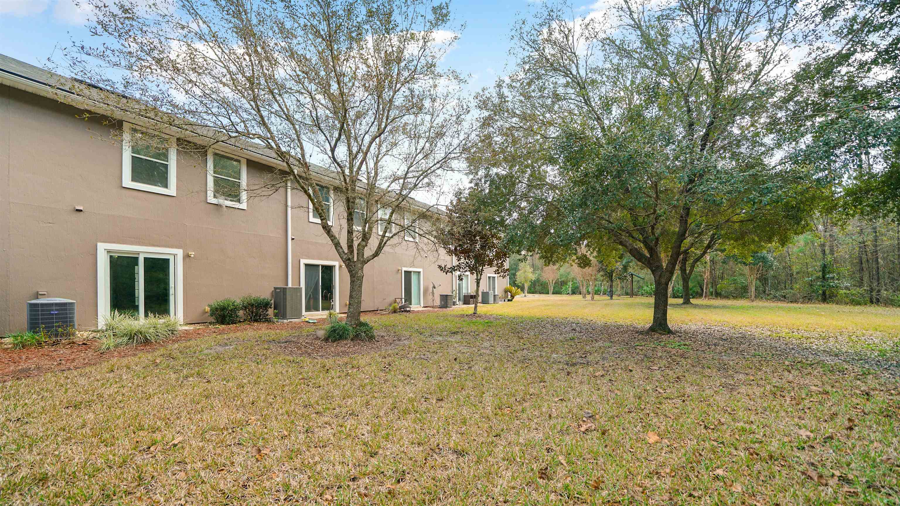 875 Scrub Jay Drive St. Augustine, FL 32092 - Photo 17 of 28 a house with trees in front of it