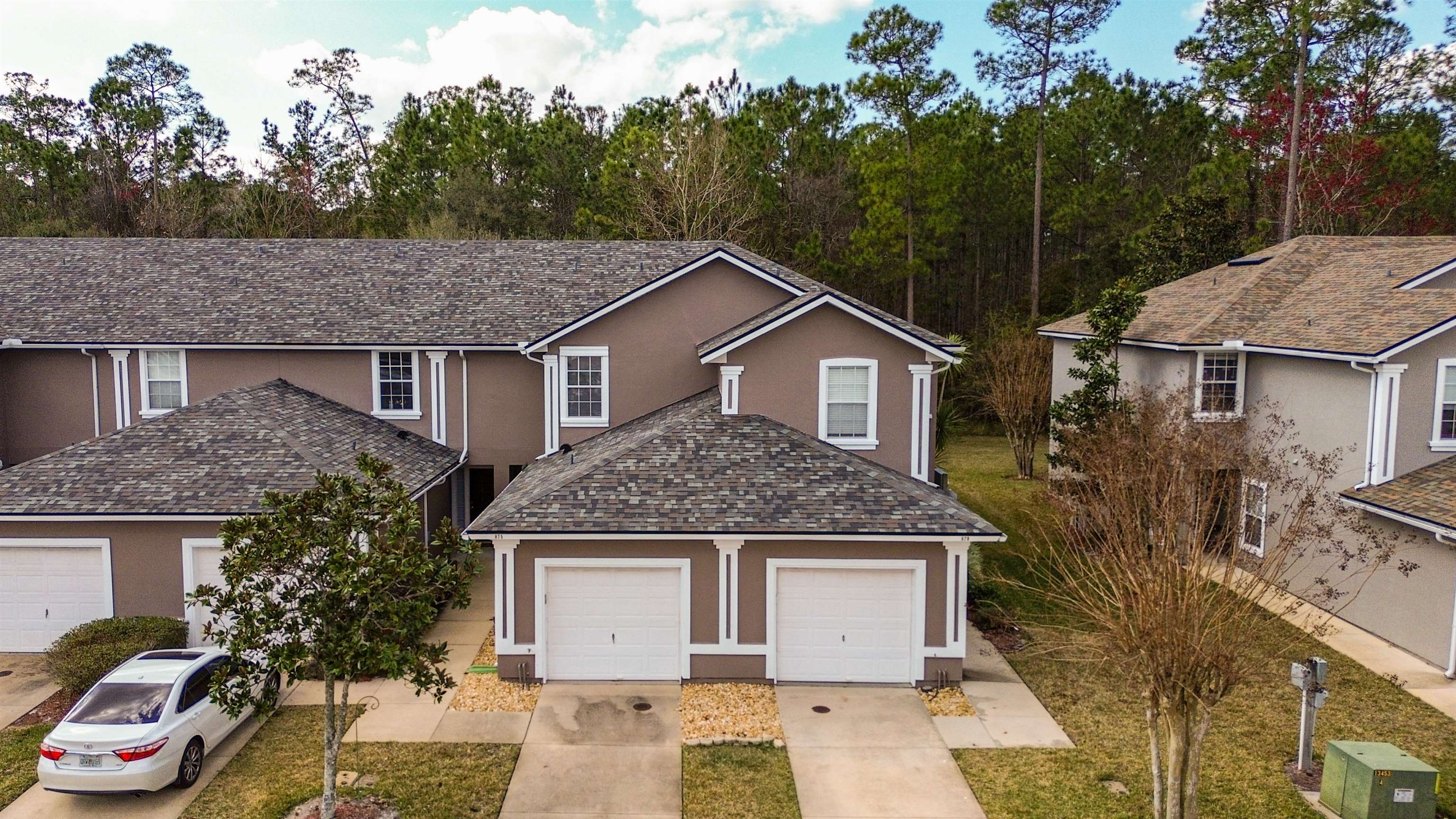 875 Scrub Jay Drive St. Augustine, FL 32092 - Photo 25 of 28 a front view of a house with a garden