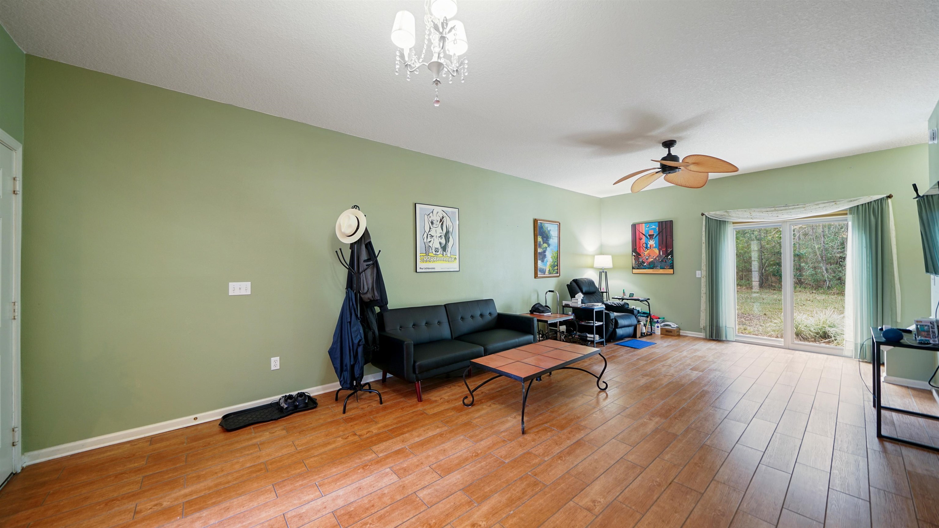 875 Scrub Jay Drive St. Augustine, FL 32092 - Photo 3 of 28 a living room with furniture and a wooden floor