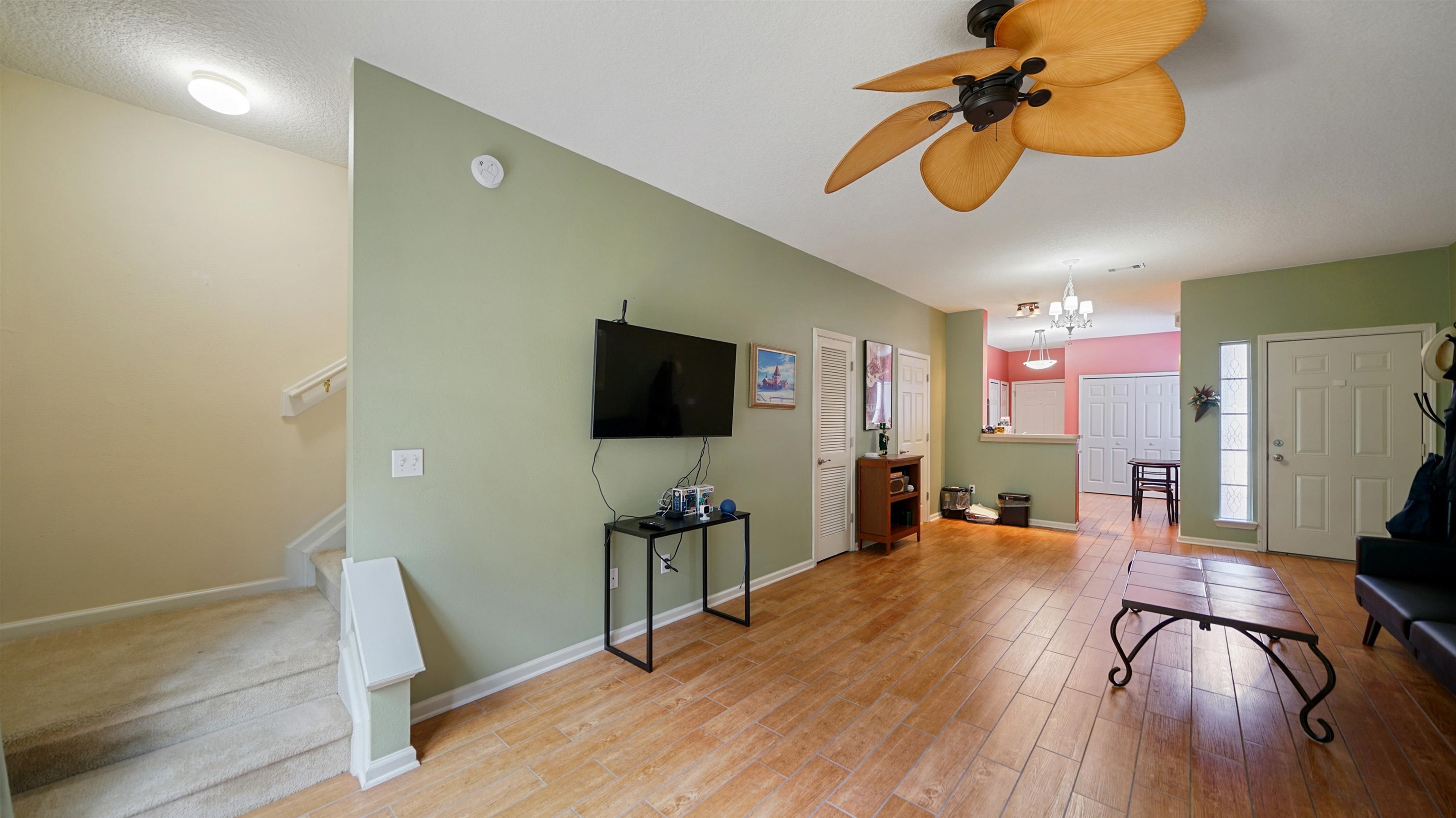 875 Scrub Jay Drive St. Augustine, FL 32092 - Photo 9 of 28 a view of a livingroom with furniture and a flat screen tv