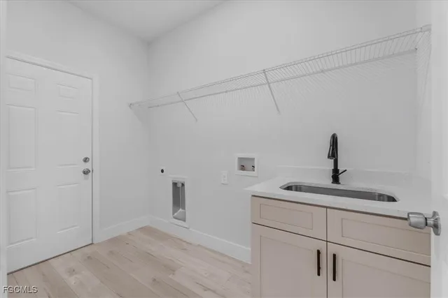 a kitchen with a sink and vanity