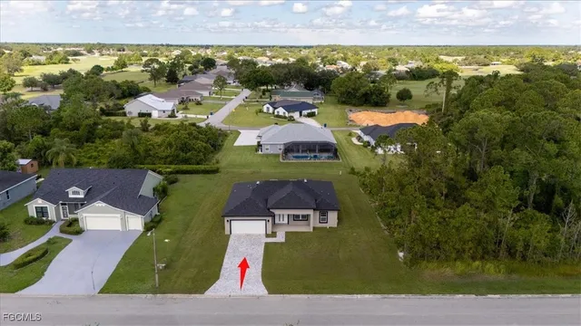 an aerial view of a swimming pool and lake view