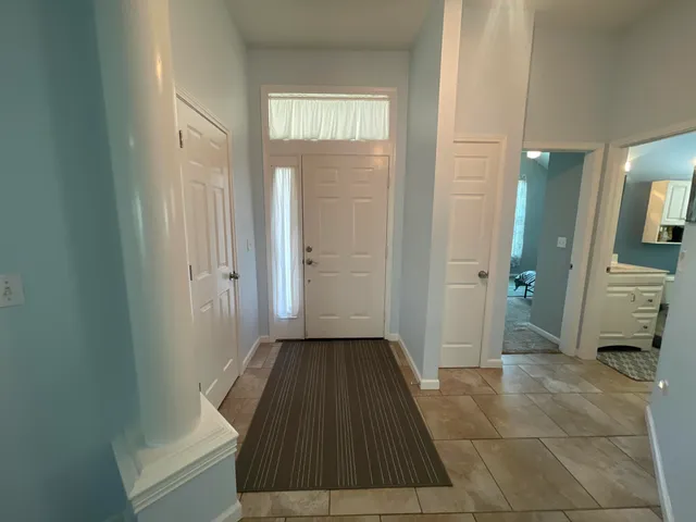 a view of a hallway with a livingroom
