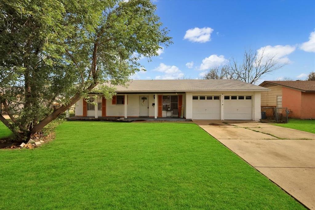 a view of a house with a back yard