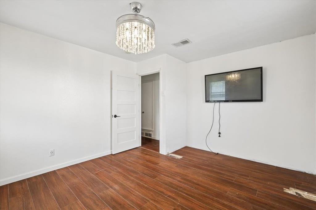 2508 West Rochelle Road Irving, TX 75062 - Photo 11 of 19 a view of empty room with wooden floor